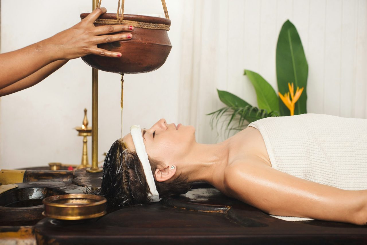 caucasian woman having ayurveda shirodhara treatment in india 1 Utpala Ayurdhama